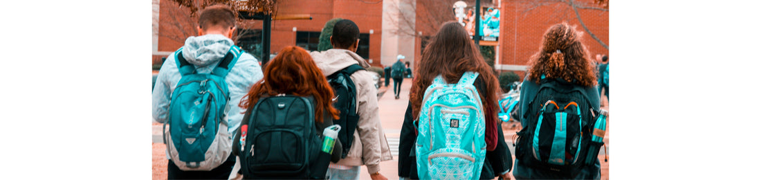 Article cover for "Campus Advocacy: Standing Strong for Israel in Challenging Environments" with five students walking with their backs turned, all with backpacks on.